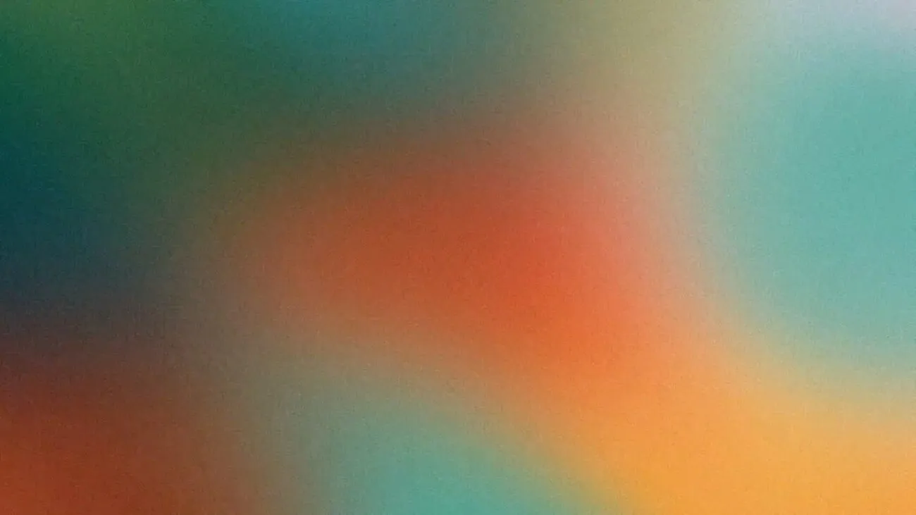 Häilyvä abstrakti taustakuva, jossa näkyy pehmeitä vihreitä, oransseja ja sinisiä sävyjä.